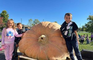 Fayette County State Champion Grower Shows off Winning Pumpkin to Local School